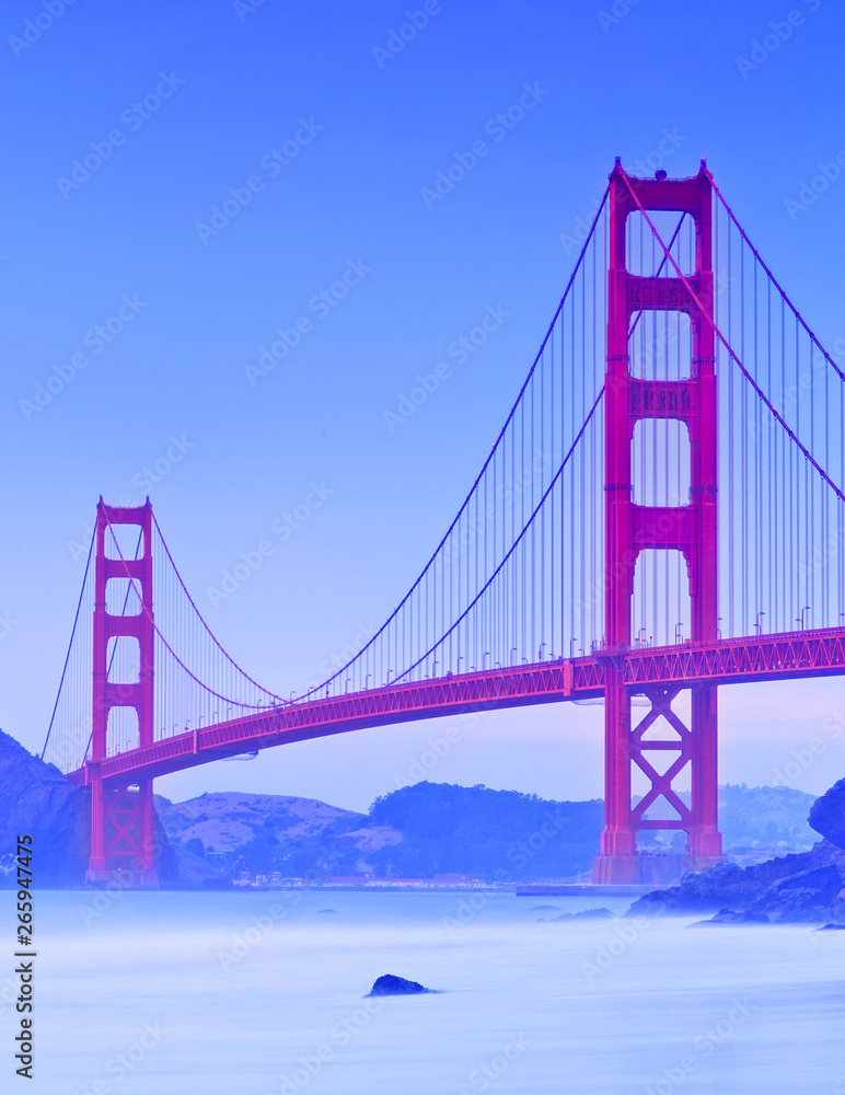Fototapeta premium View of Golden Gate Bridge from Marshall's Beach in San Francisco at sunset.