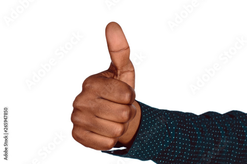 Hand of an African man with thumb up.