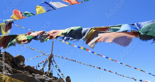 Himalaya mountains background with Buddhist flags slow motion video. North India travel landscape