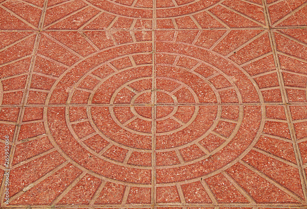Stone texture. Background of red stone on the street of the city, in round patterns. Stone texture. Background of red stone on the street of the city, in round patterns.