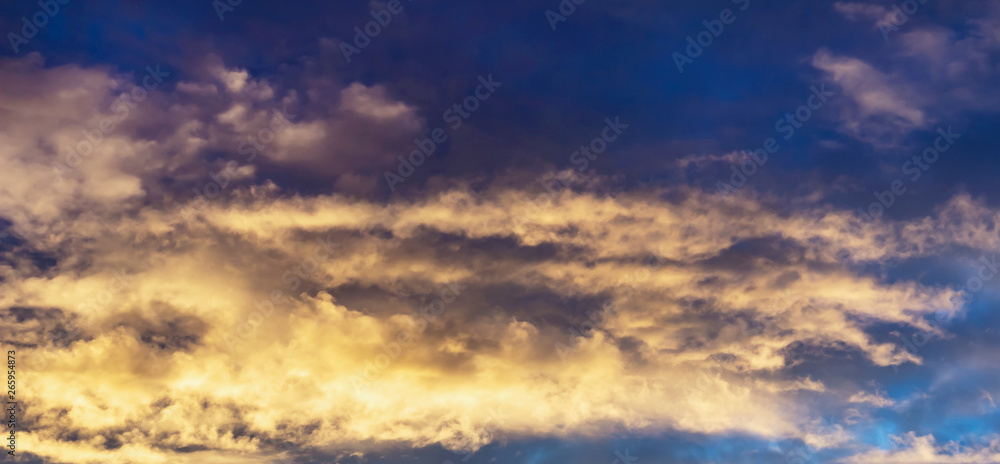 blue dark sky background with white and yellow clouds, nature series