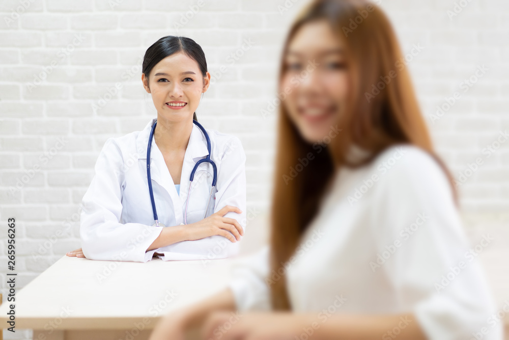 Female doctor talking to patient.Doctor and patient discussing something while sitting at the table . Medicine and health care concept. Doctor and patient Female doctor talking to patient.Doctor and patient discussing something while sitting at the table . Medicine and health care concept. Doctor and patient