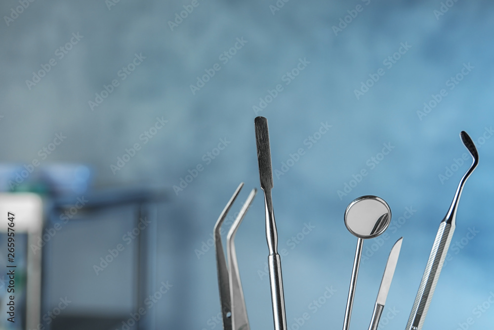 Professional dentist tools on blurred background, space for text Professional dentist tools on blurred background, space for text