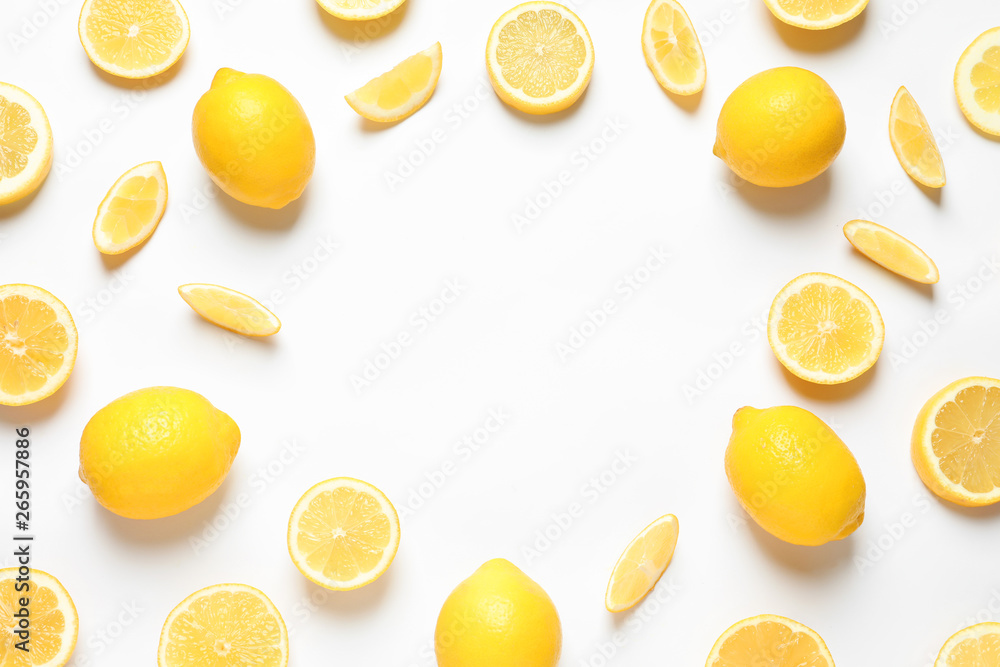 Frame made of lemons on white background, top view with space for text. Citrus fruits
