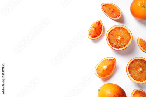 Fresh bloody oranges on white background, top view. Citrus fruits