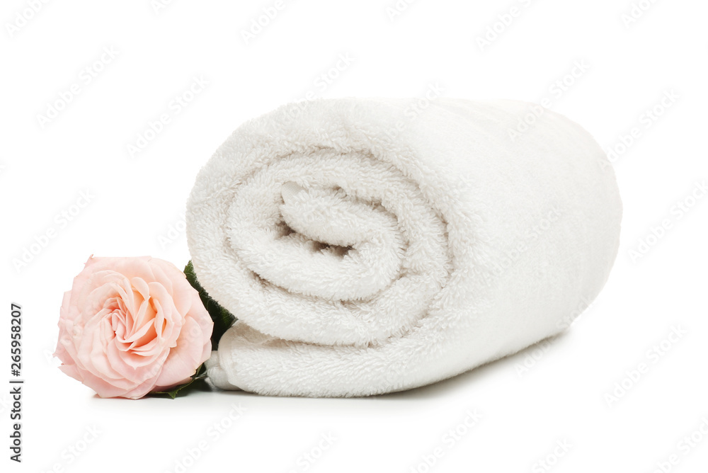 Clean rolled towel with flower on white background Clean rolled towel with flower on white background