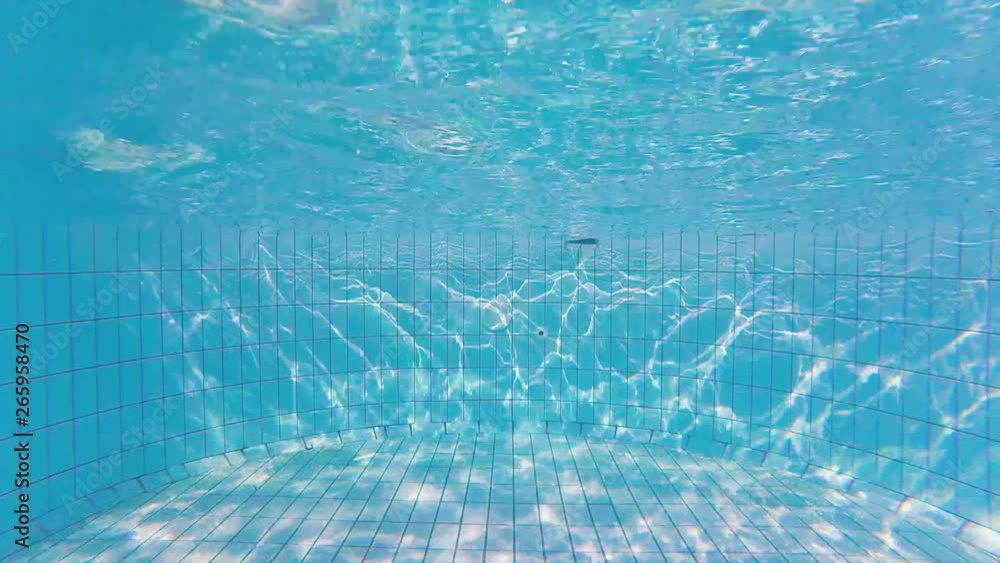 Wave texture on the bottom of swimming pool and sun rays Stock Video ...