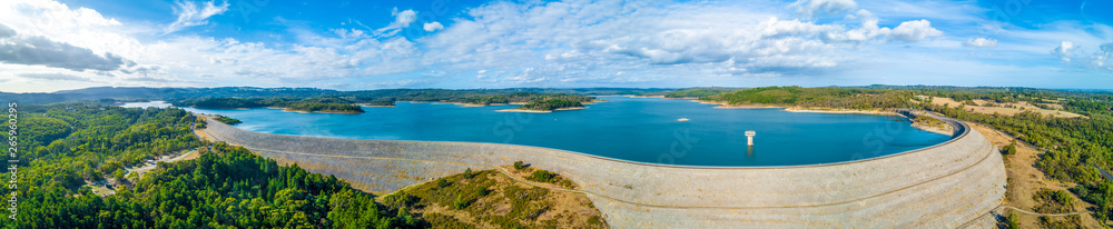 Wide aerial panorama of Cardinia Reservoir lake and dam wall surrounded by forest