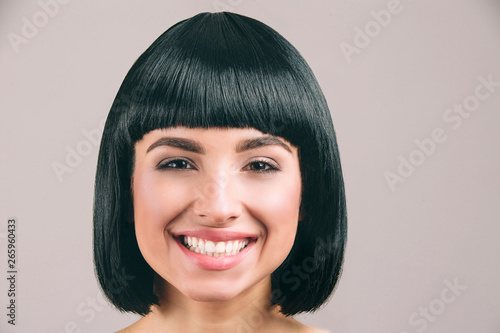 Canvas Young woman with black hair posing on camera