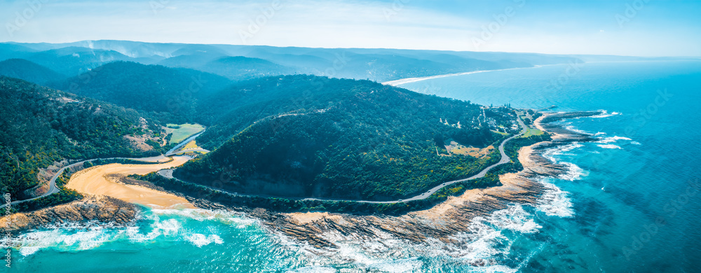 Wide panorama of the famous Great Ocean Road and forested hills in Victoria, Australia