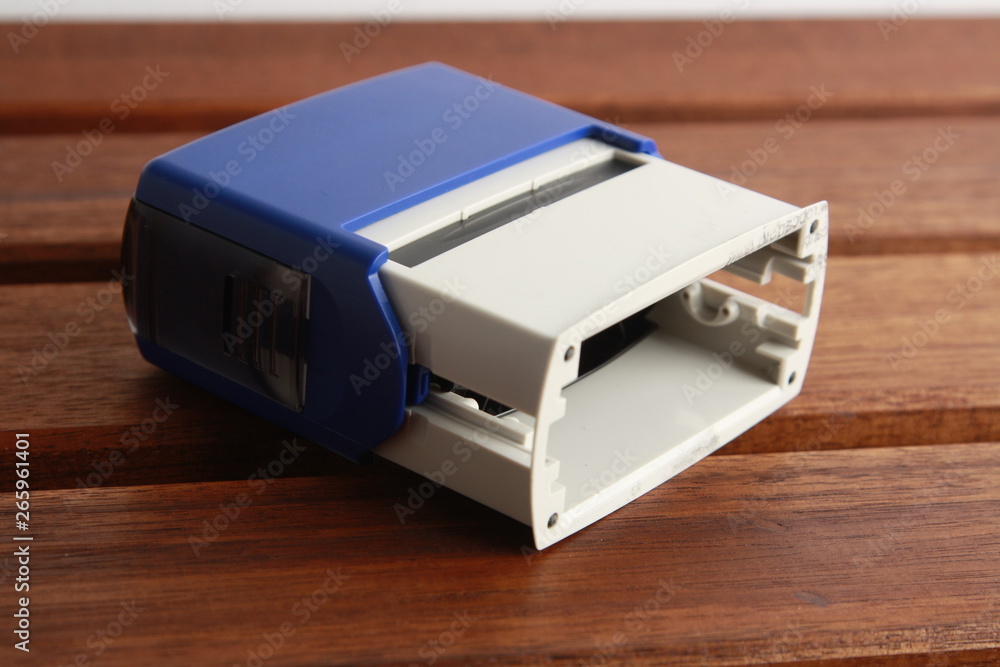 Automatic ink stamp manufactured in blue plastic