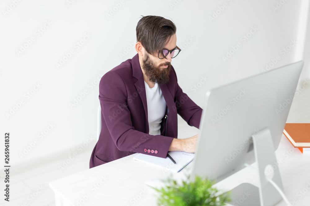 People and technology concept - Man sits and works at the computer People and technology concept - Man sits and works at the computer