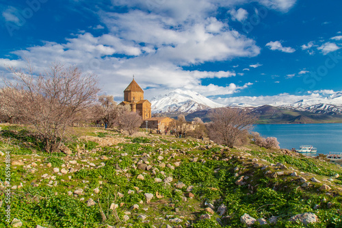 Church on the Akdamar Island ın Turkey with blue lake and snowy mountains