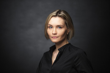 Portrait of a beautiful woman on a dark background