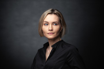 Portrait of a beautiful woman on a dark background