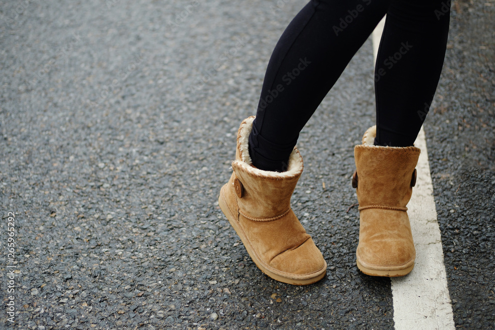 Photo of girls foot at cold day in warm clothes Photo of girls foot at cold day in warm clothes