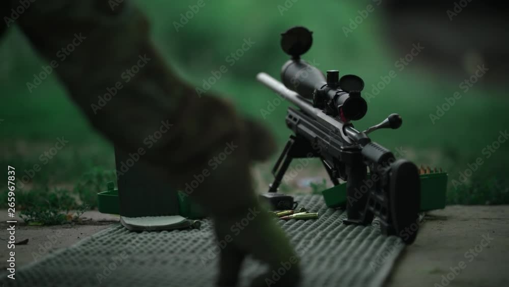 Sniper takes a firing position. Slow Motion. 4K. Sniper takes a firing position. Slow Motion. 4K.