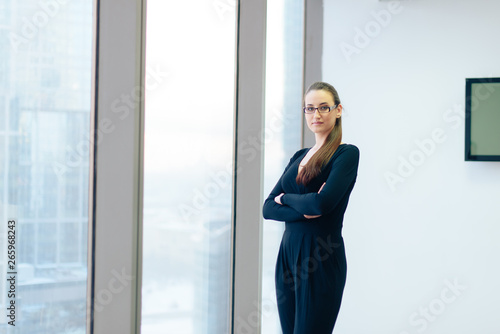 beautiful girl business lady in her office in a skyscraper Free Download beautiful girl business lady in her office in a skyscraper - GFXLoad