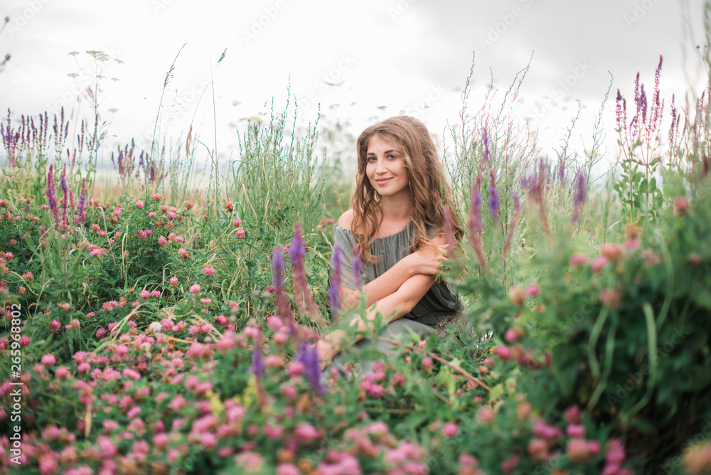 beautiful girl in green dress in flower field in spring outdoors beautiful girl in green dress in flower field in spring outdoors