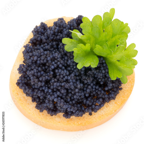 Canapes with black sturgeon caviar and  parsley. Isolated on the white background.