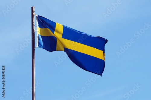 national flag of sweden against blue sky