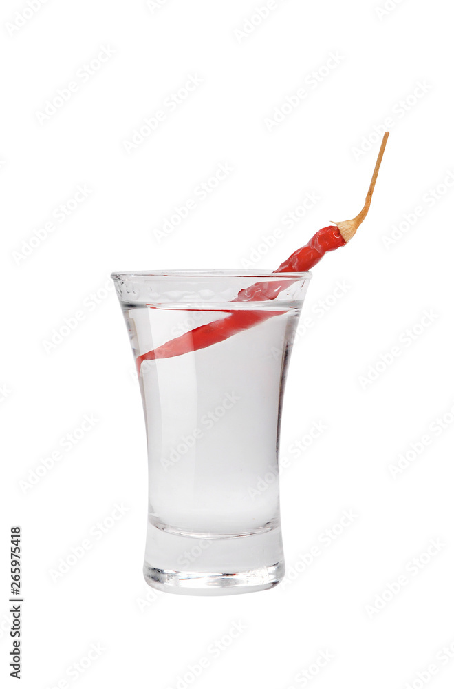 Shot of vodka and red hot chili pepper. Isolated on white background Shot of vodka and red hot chili pepper. Isolated on white background