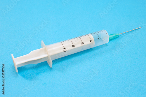 Syringe isolated on blue background