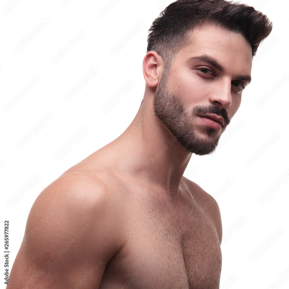 side view of a undressed man with beard looking charming side view of a undressed man with beard looking charming
