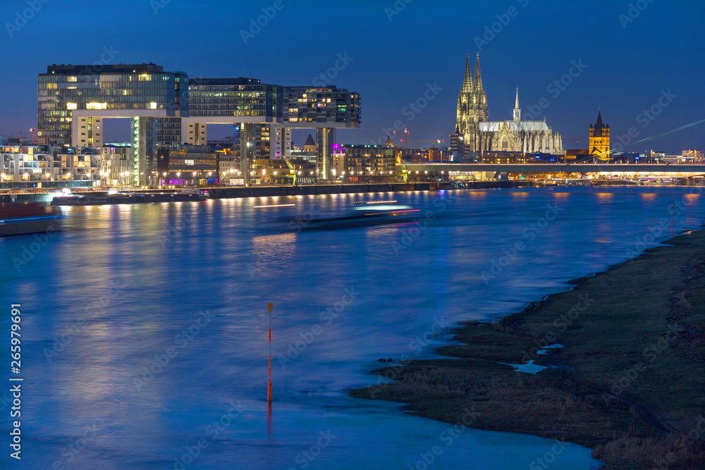 dom of cologne and the rhine river front at night in germany
