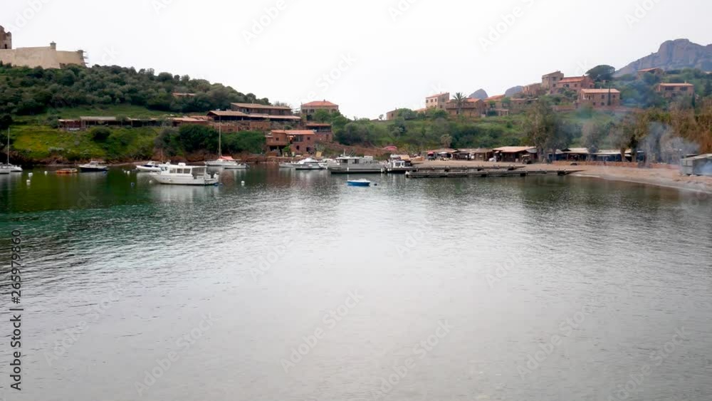 Girolata, Corsica Regional Park, France - april 20 2019: fishing village of Girolata and port with typical red cliffs of volcanic origin. Scandola Nature Reserve a Natural World Heritage Site Girolata, Corsica Regional Park, France - april 20 2019: fishing village of Girolata and port with typical red cliffs of volcanic origin. Scandola Nature Reserve a Natural World Heritage Site