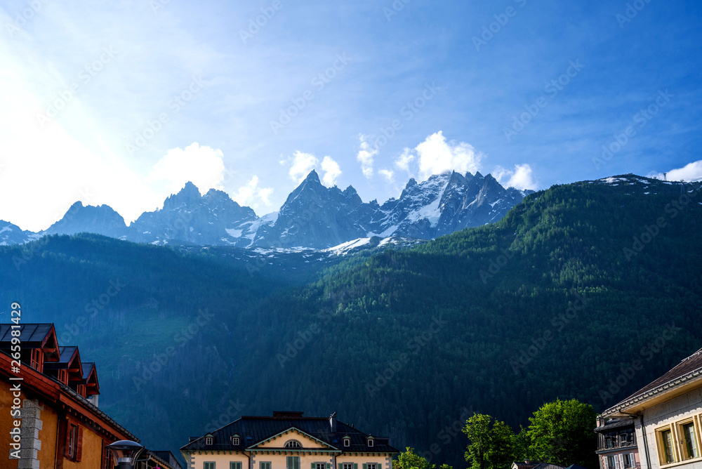Amazing scenery of the Alps from Chamonix France. Chamonix downtown in summer. Beautiful buildings on a sunny day of summer. Flowers, colorful facades.