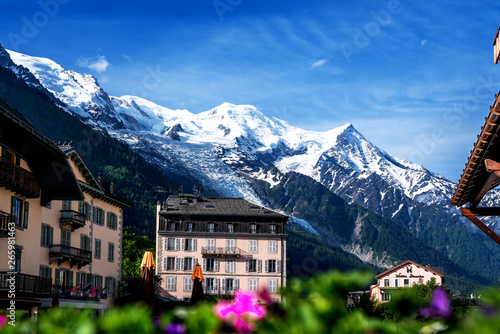 Amazing scenery of the Alps from Chamonix France. Chamonix downtown in summer. Beautiful buildings on a sunny day of summer. Flowers, colorful facades.