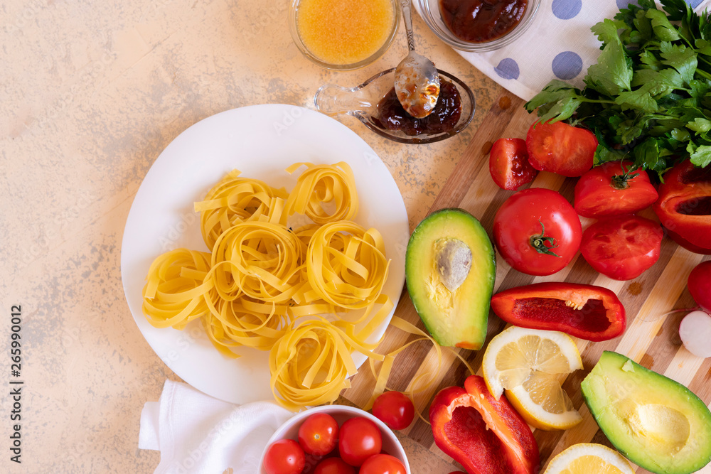 raw spaghetti and ingredients for cooking pasta on the tables, differrent sauces, italian restaurant foods raw spaghetti and ingredients for cooking pasta on the tables, differrent sauces, italian restaurant foods