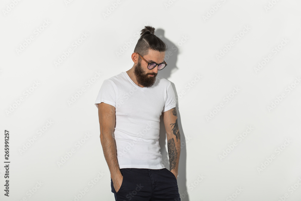 Beauty, fashion and people concept - Cool man with beard posing over white background with copy space Beauty, fashion and people concept - Cool man with beard posing over white background with copy space