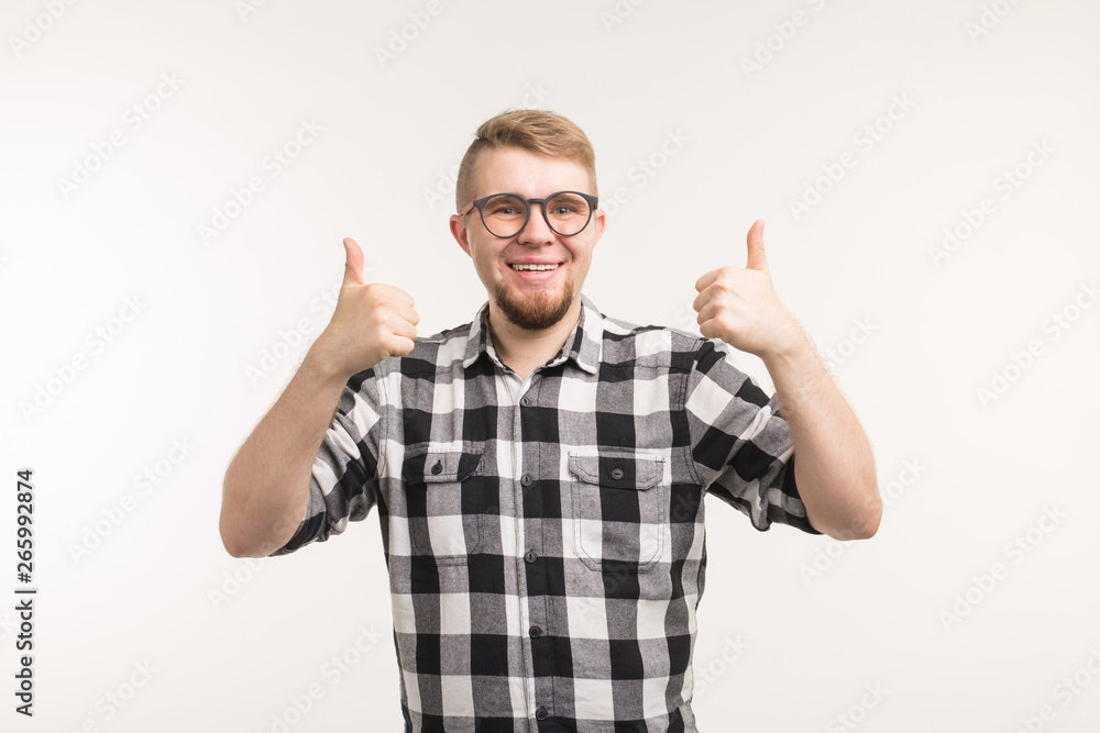 People and education concept - Smiling student man gesturing thumbs up over white background People and education concept - Smiling student man gesturing thumbs up over white background