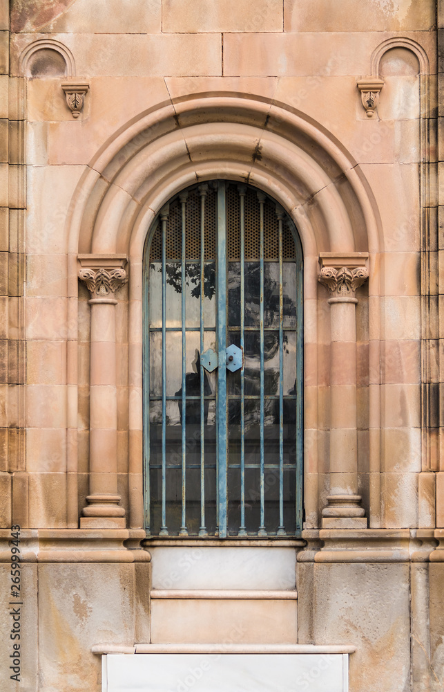 The door of the stone crypt on the Montjuic Cemetery closeup front view, Barcelona, Catalonia, Spain The door of the stone crypt on the Montjuic Cemetery closeup front view, Barcelona, Catalonia, Spain