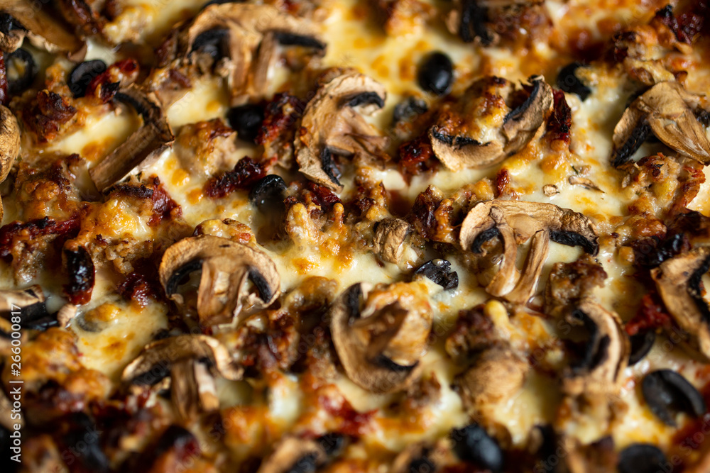 Close up shot of pizza on the table. Selective focus. Close up shot of pizza on the table. Selective focus.