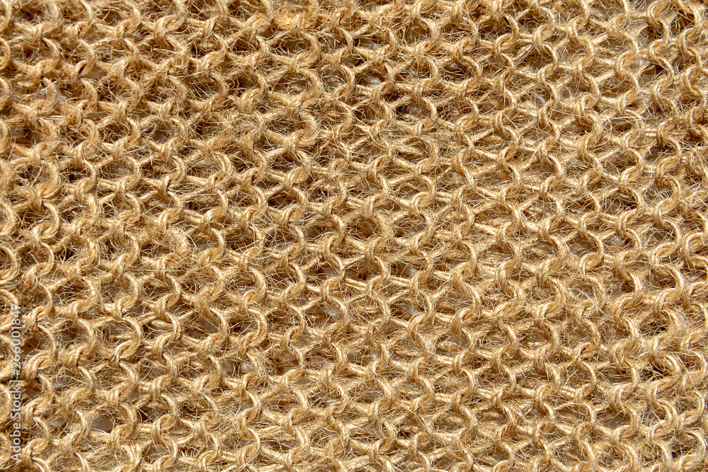The texture of the knitted fabric from the threads of natural wool fibers.