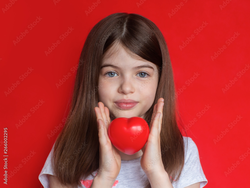 cute little girl with red heart, concepts of love, childhood, help and medical cute little girl with red heart, concepts of love, childhood, help and medical