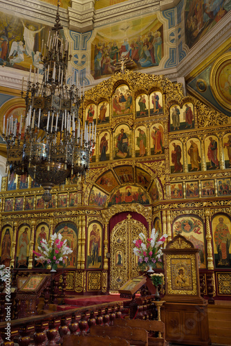 Interior of Ascension Cathedral in Almaty Kazakhstan with gold leaf iconostasis wall to the sanctuary