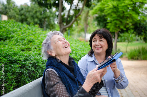 Senior woman is happy with the first success in using the tablet