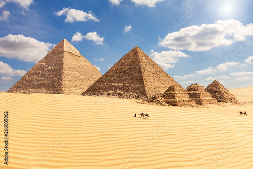 The Pyramid of Chephren  the Pyramid of Menkaure and its companions in the sands of Giza desert  Egypt