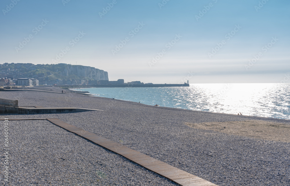 Mers-Les-Bains, France - 04 29 2019: Cliffs and beach at Sunset