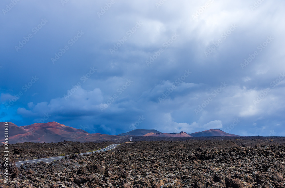 Landscape of a storm over the volcanoes of Timanvaya