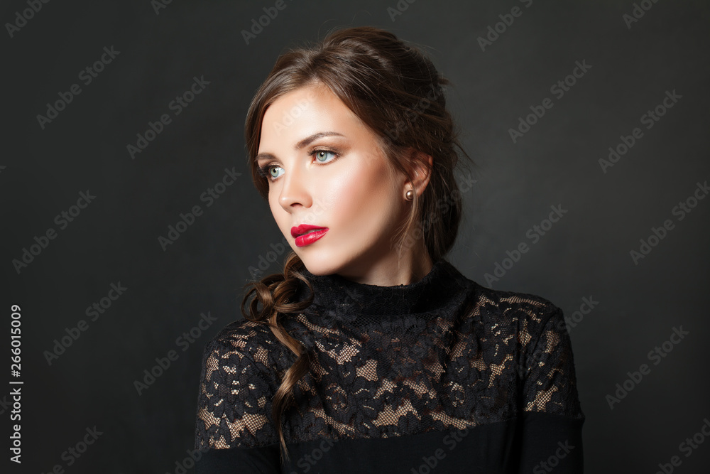 Perfect elegant woman with red lips makeup hair on black background