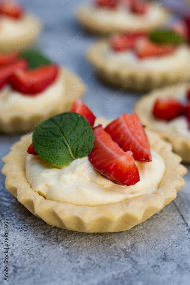Strawberry tart with cream and mint traditional summer sweet pastry fruit dessert Strawberry tart with cream and mint traditional summer sweet pastry fruit dessert