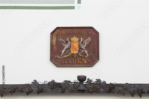 historic Baden coat of arms on a white house wall German text Grand Duchy of Baden