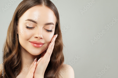 Young perfect woman with clear skin smiling, spa wellness portrait