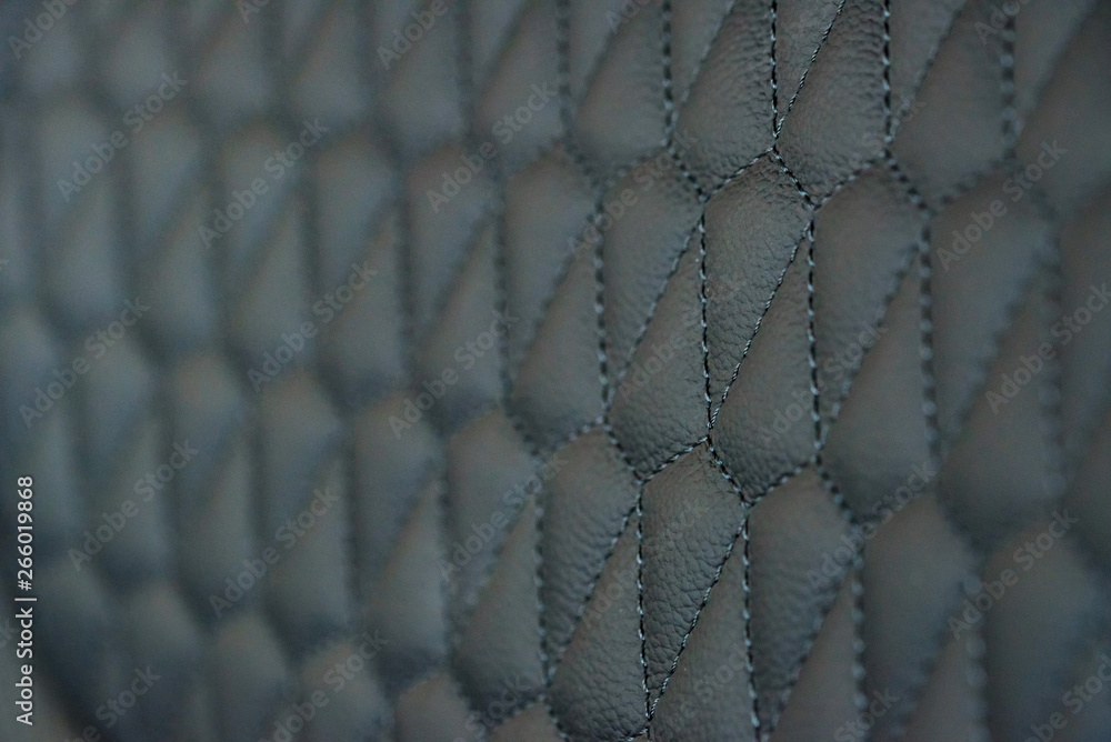 Fototapeta premium Perforated leather seat texture in modern car close