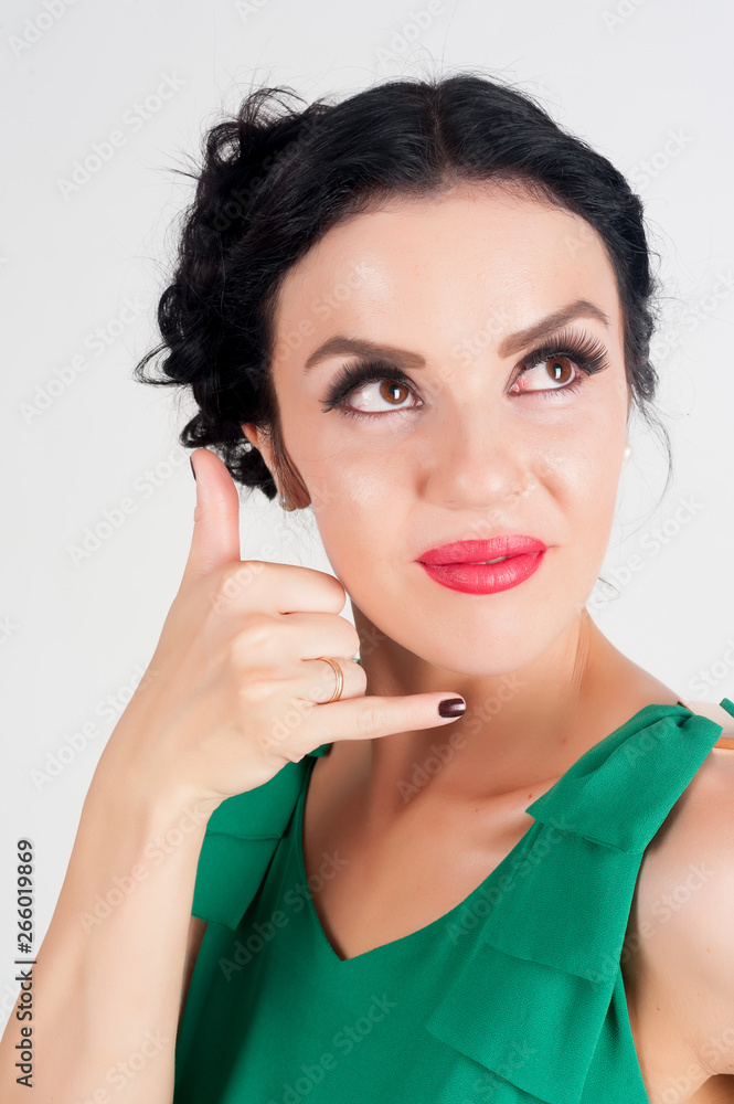 Attractive woman shows Call Me Sign Attractive woman shows Call Me Sign